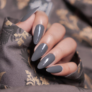 Nails & More shade 50 Dark Grey β elegant dark grey gel-shine nail polish with smooth coverage, glossy long-wear finish, vegan and non-toxic formula.